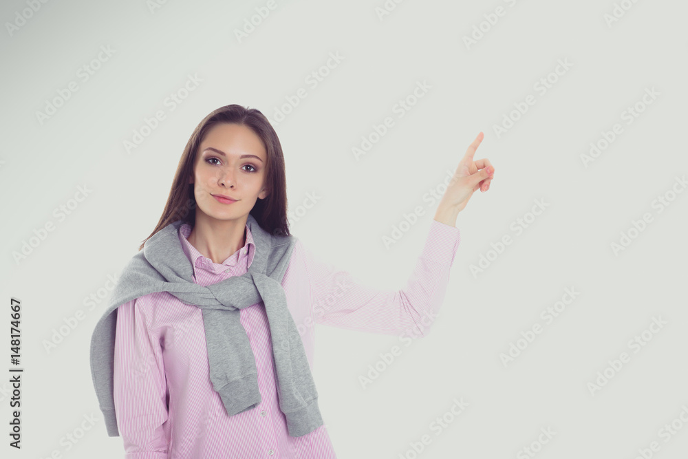 Young woman standing on the white background Young woman standing on the white background
