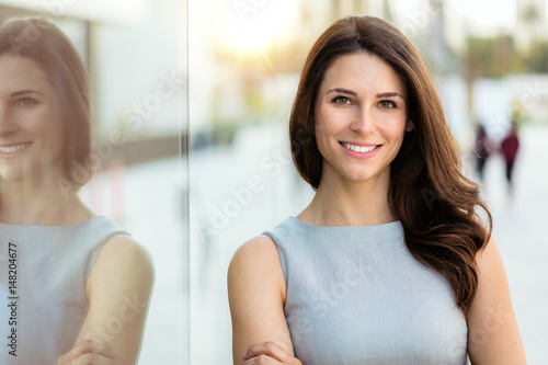 Fotobehang Head shot of a smiling successful beautiful brunette with career, confidence, ha