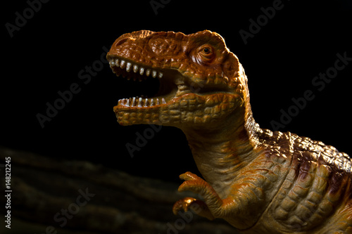 Dinosaur silicone model for education with dark background.