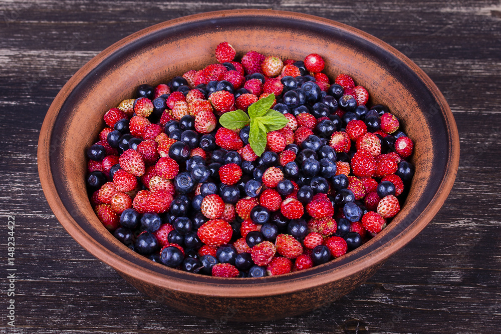 Fresh strawberries and blueberries , wild berry. Fresh strawberries and blueberries , wild berry.