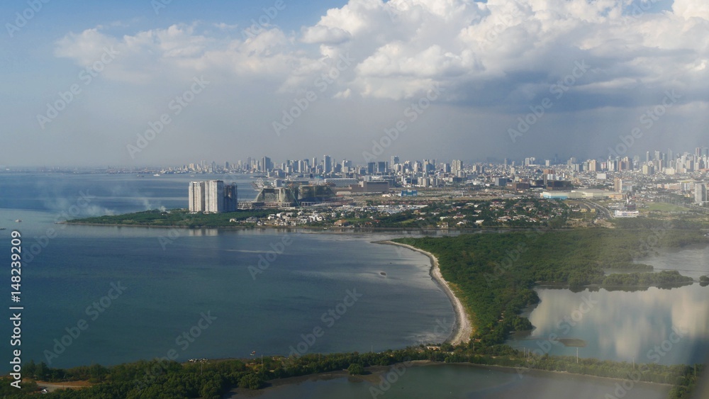 Aerial view, Manila Aerial view heading to the Ninoy Aquino International Airport in Manila, Philippines Aerial view, Manila Aerial view heading to the Ninoy Aquino International Airport in Manila, Philippines
