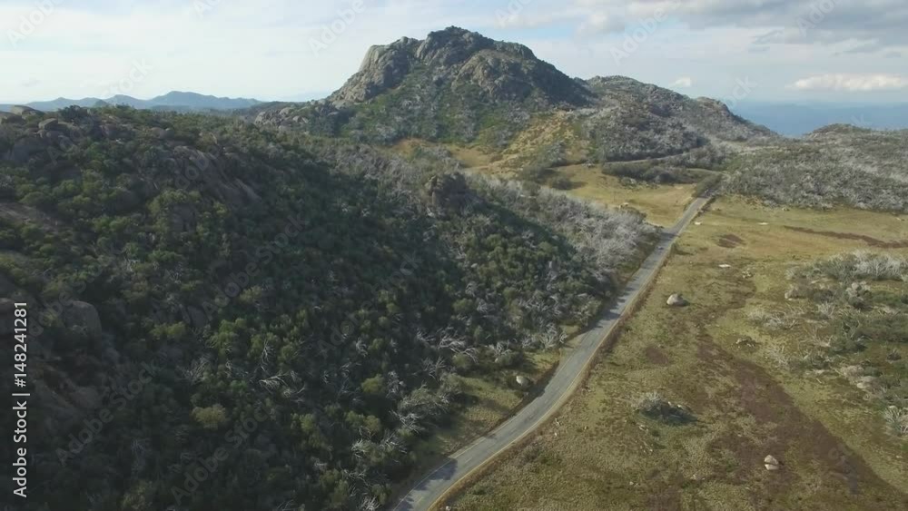 Slow rise above road crossing Mount Buffalo Plateau, Victoria, Australia Slow rise above road crossing Mount Buffalo Plateau, Victoria, Australia