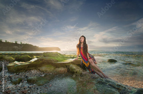 Elegant girl, model in a beautiful image by the sea.