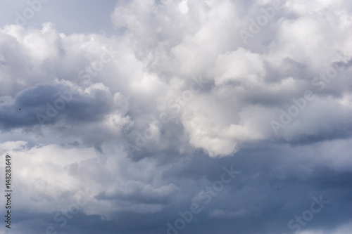 Beautiful blue sky with clouds at sunset. Cloudy sky background.