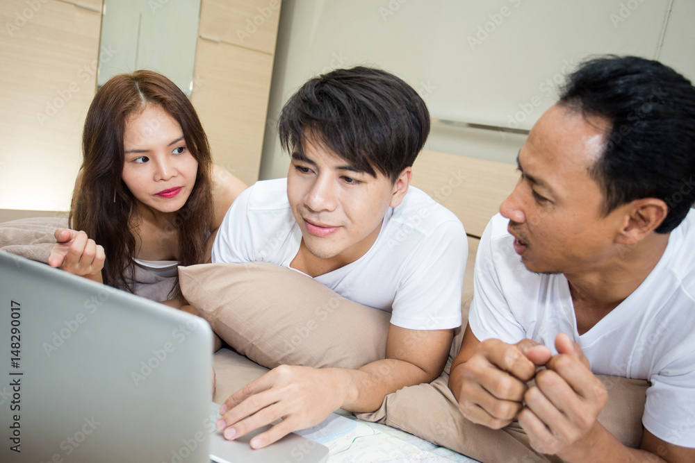 Group of man and woman using computer in the room. lifestyle people concept. Group of man and woman using computer in the room. lifestyle people concept.