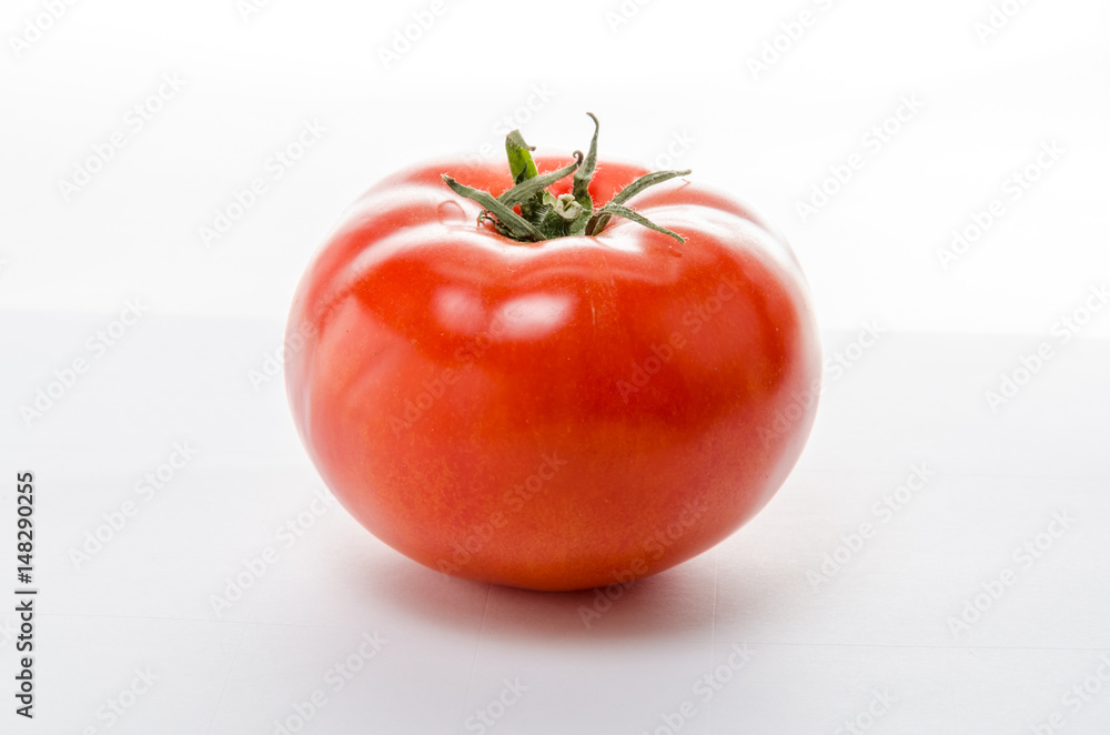 Red tomato on a white background.Isolated Red tomato on a white background.Isolated
