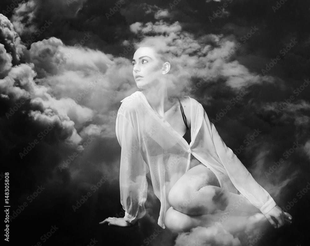 Fototapeta premium Monochrome double exposure of beautiful and thoughtful girl and stormy cloudscape