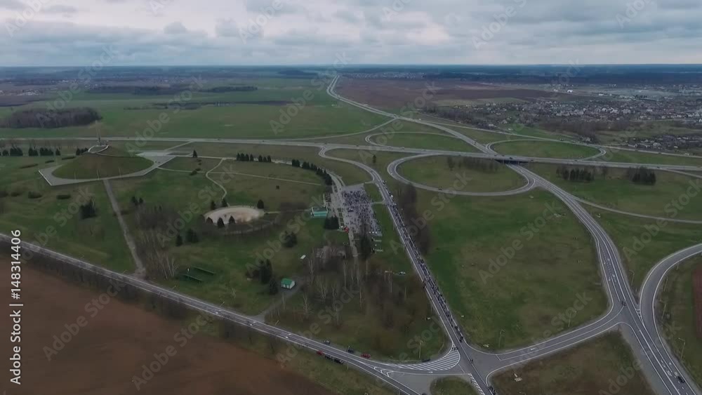 Aerial view from the height to the road junction, outside the city. 50fps.
Aerial view from the height to the road junction, outside the city. 50fps.