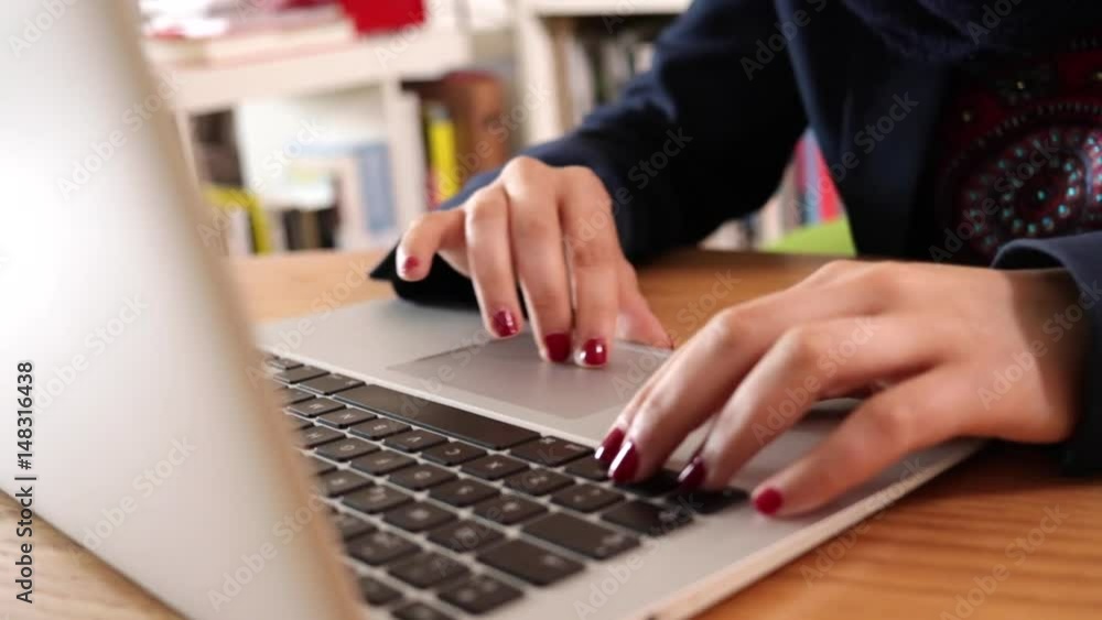 Businesswoman in a modern office working in her laptop. Slow motion video. Businesswoman in a modern office working in her laptop. Slow motion video.