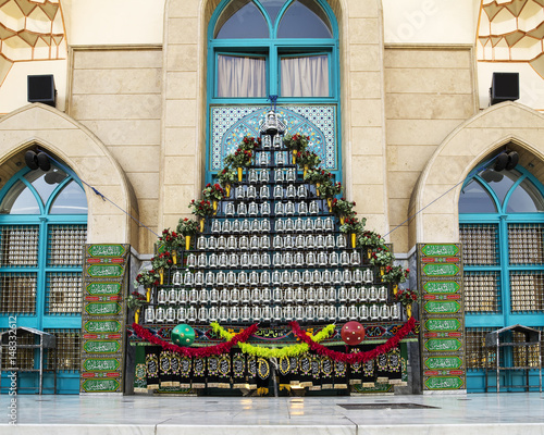 TEHRAN, IRAN - October 12, 2016: lanterns and Shiite saints' names embroidered and printed on fabrics in front of Imam Sadiq mosque. This is a symbol of mourning of Imam Husayn martyrdom. photo