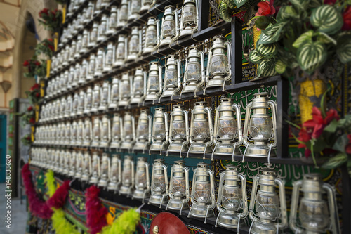 Schilderij op canvas TEHRAN, IRAN - October 12, 2016: kerosene lamps in front of a mosque, as a symbol of religious mourning of Imam Husayn martyrdom in the Battle of Karbala
