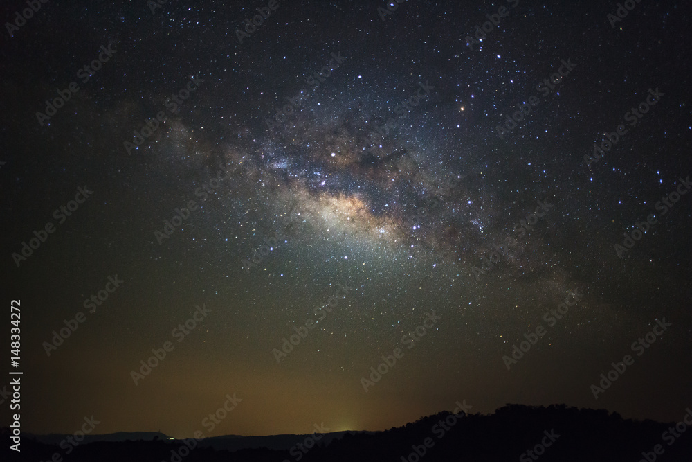 Milky way galaxy with stars over moutain at Phu Hin Rong Kla National Park,Phitsanulok Thailand, Long exposure photograph.with grain