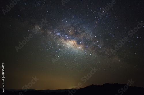 Milky way galaxy with stars over moutain at Phu Hin Rong Kla National Park,Phitsanulok Thailand, Long exposure photograph.with grain