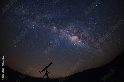 Telescopes with milky way galaxy, Night sky with stars, Long exposure photograph, with grain.