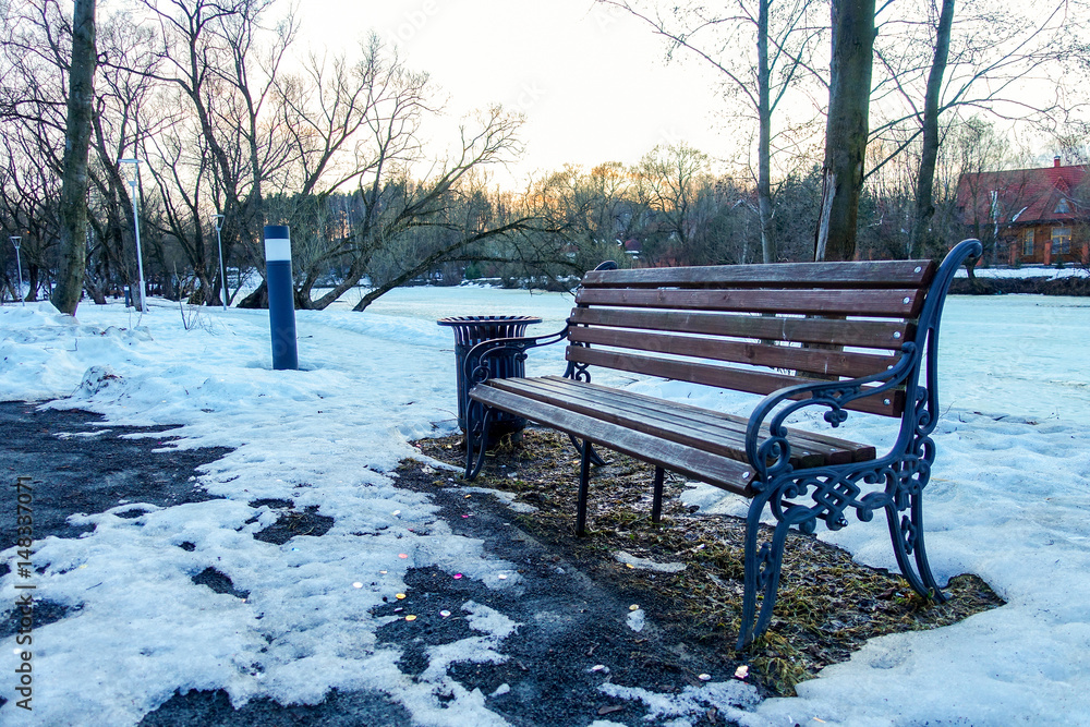 Bench in the winter in the park