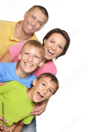 Happy family with young children on a white background