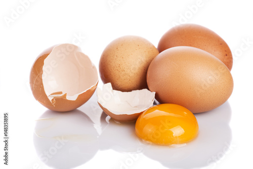 Close up broken egg isolated on white background