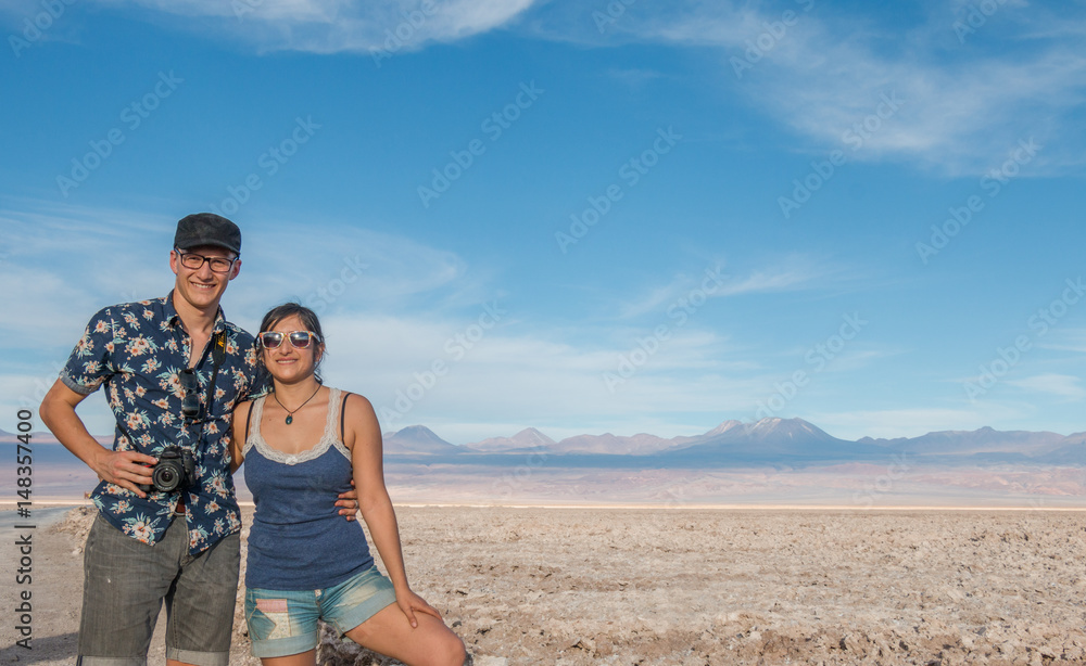 Couple enjoying at Chaxa Lagoon in Atacama Desert, Chile.