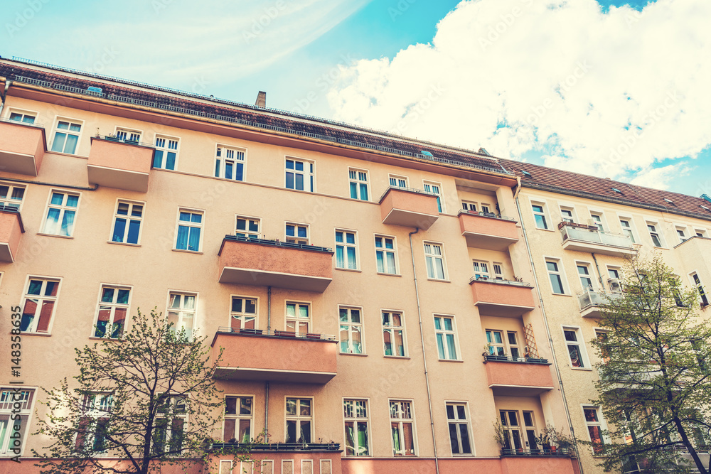 brown and orange facades of apartment blocks with balconies brown and orange facades of apartment blocks with balconies