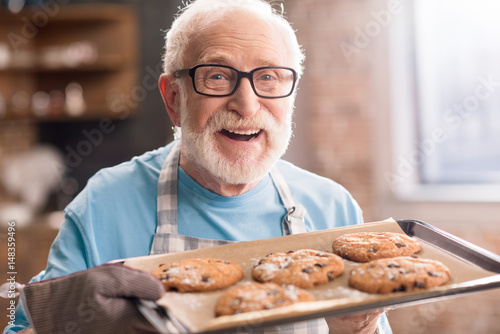 Senior man with cookies