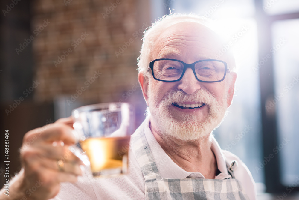 senior man with cut of tea senior man with cut of tea