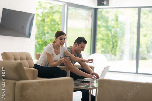 happy young couple buying online