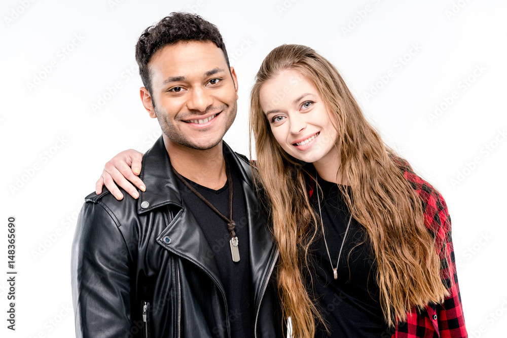 Happy young couple standing embracing and smiling at camera isolated on white Happy young couple standing embracing and smiling at camera isolated on white