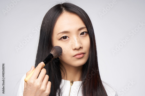 woman with makeup brush, soft bristles