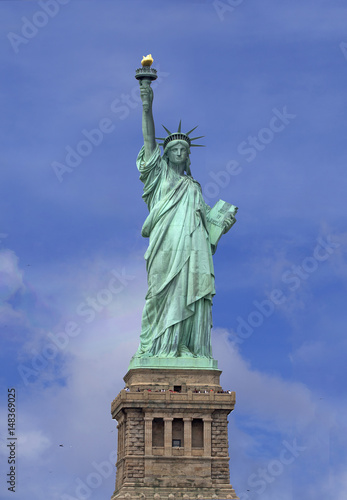 Statue of Liberty over blue sky