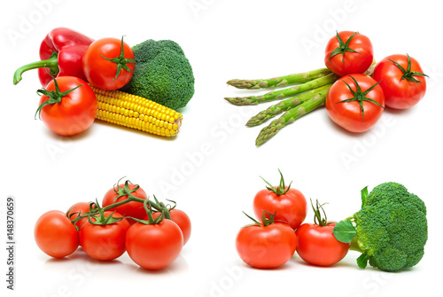 Ripe tomatoes and other vegetables on a white background