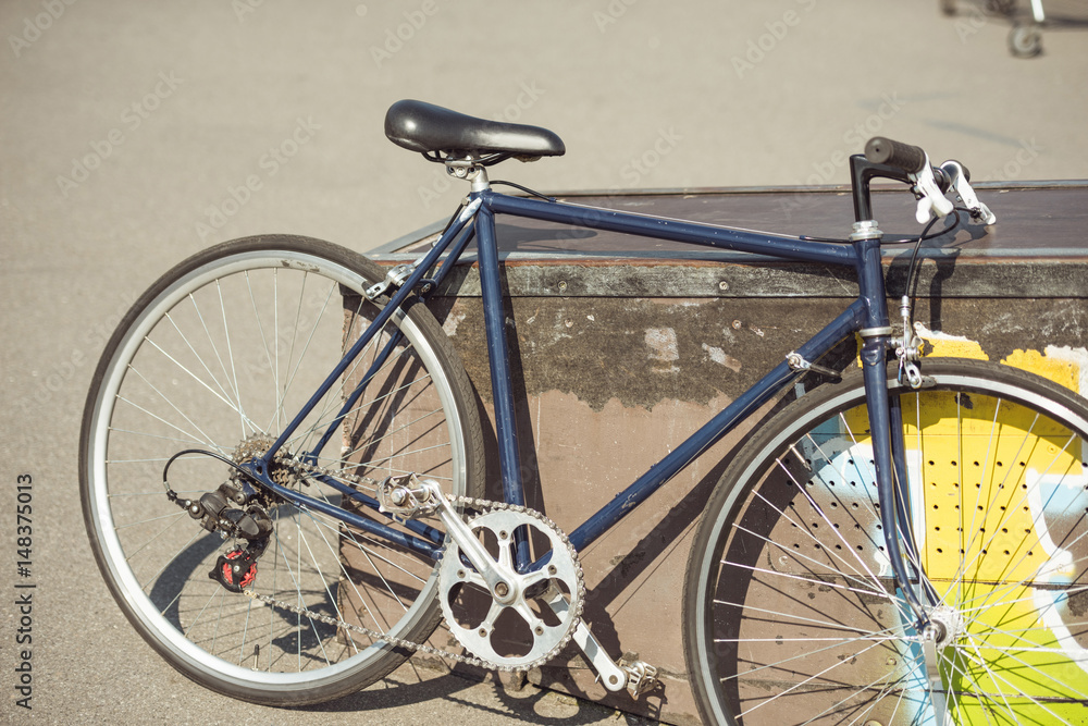 fix bicycle standing in empty skateboard park, urban scene fix bicycle standing in empty skateboard park, urban scene