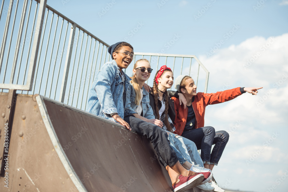 teenagers spending time at skateboard park, teenagers having fun concept