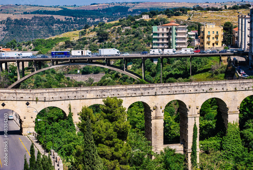 Ragusa, Italy - June 02, 2010: View of the two bridges of Ragusa from the third highest bridge on a traffic day in Sicily