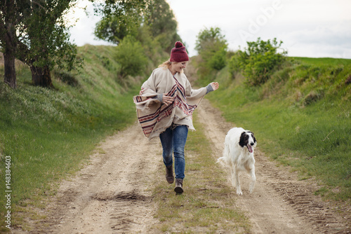 Active woman running outdoor with dog