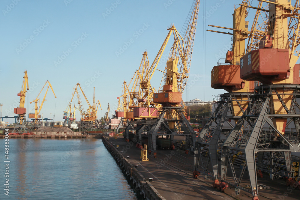Seaport cargo cranes over blue sky background Seaport cargo cranes over blue sky background