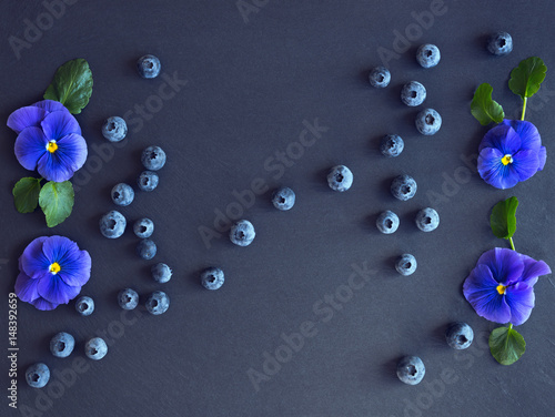 Midsummer decoration with blueberry and pansies. photo