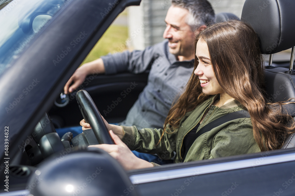 Teen learning to drive or taking driving test. Teen learning to drive or taking driving test.