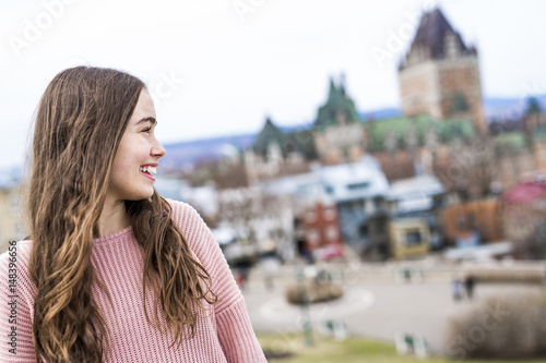 Quebec City scape with Chateau Frontenac and young teen enjoying the view. © Louis-Photo