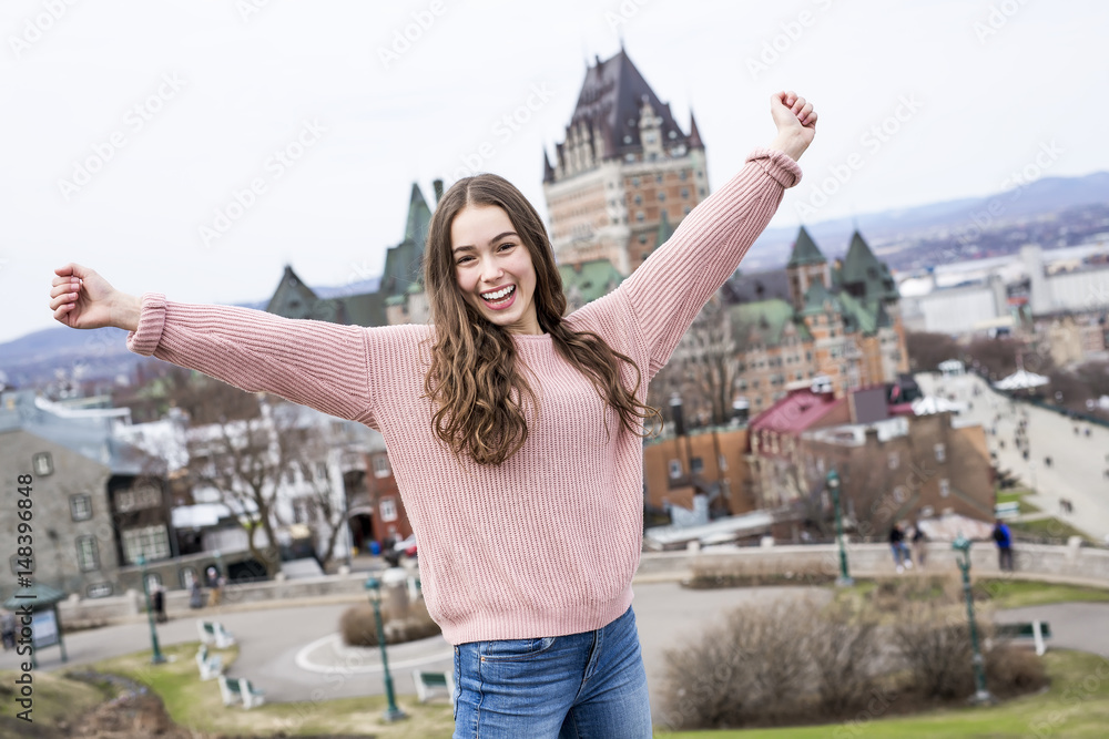 Quebec City scape with Chateau Frontenac and young teen enjoying the view. Quebec City scape with Chateau Frontenac and young teen enjoying the view.