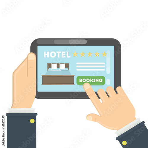 Online hotel booking. Hands holding tablet to book a room in the hotel.