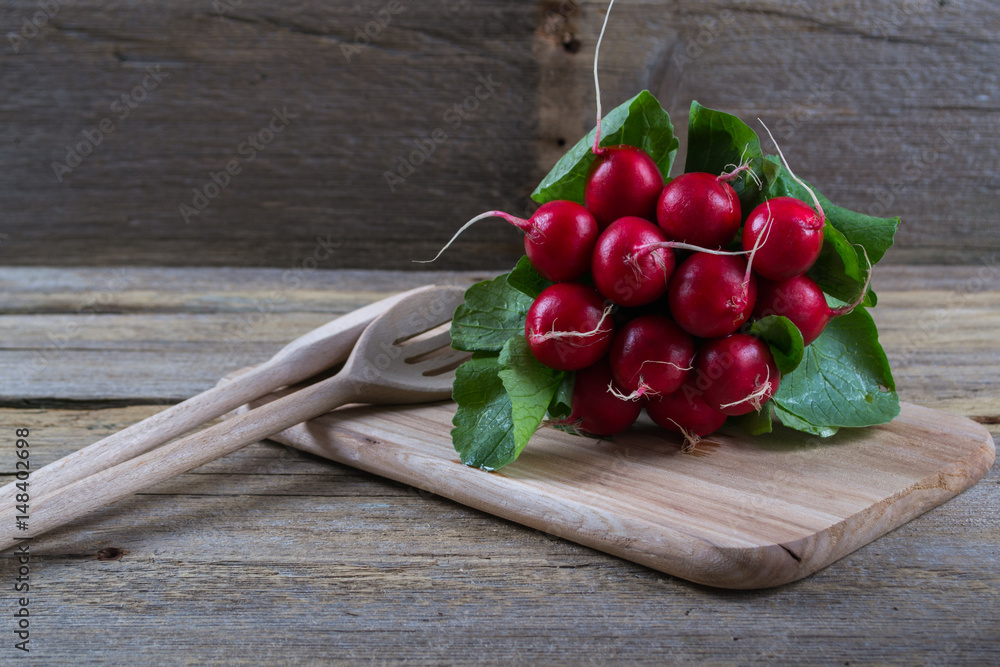 Farm fresh radish on rustic wooden board Farm fresh radish on rustic wooden board