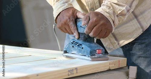 Non identify carpenter work with machine to be in good order photo