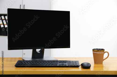 computer screen PC and cup of coffee. for business on the table