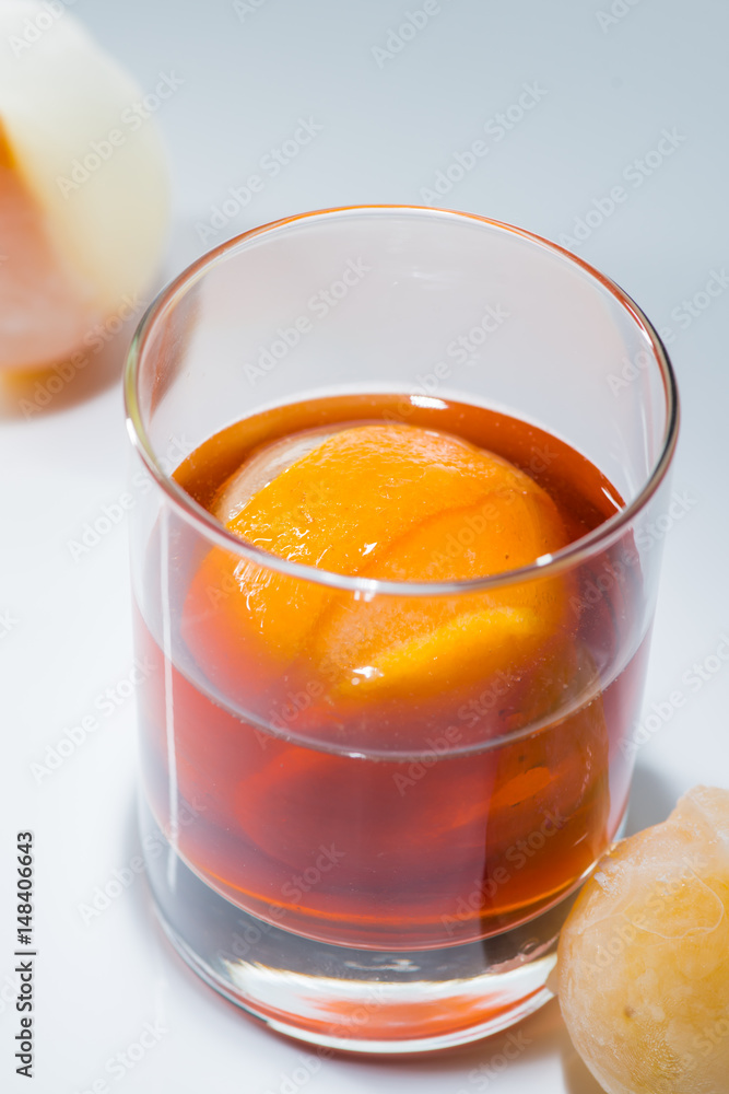 Alcohol cocktail with mandarin ice bal Alcohol cocktail with mandarin ice bal