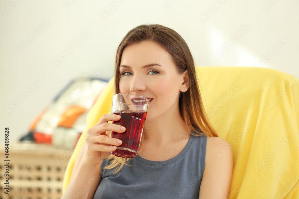 Beautiful woman drinking fresh juice at home Beautiful woman drinking fresh juice at home