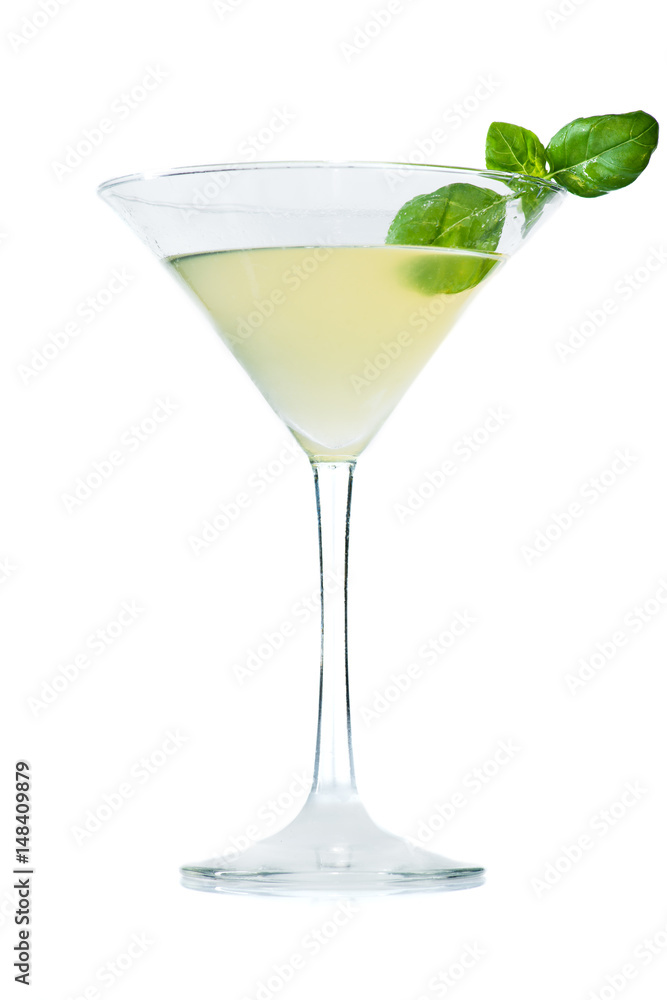 Alcoholic cocktail in martini glass with basi
