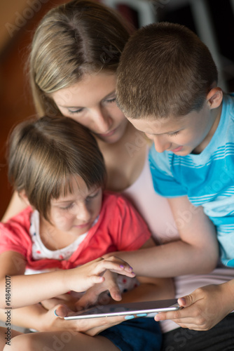 Young Family Using A Tablet To Make Future Plans