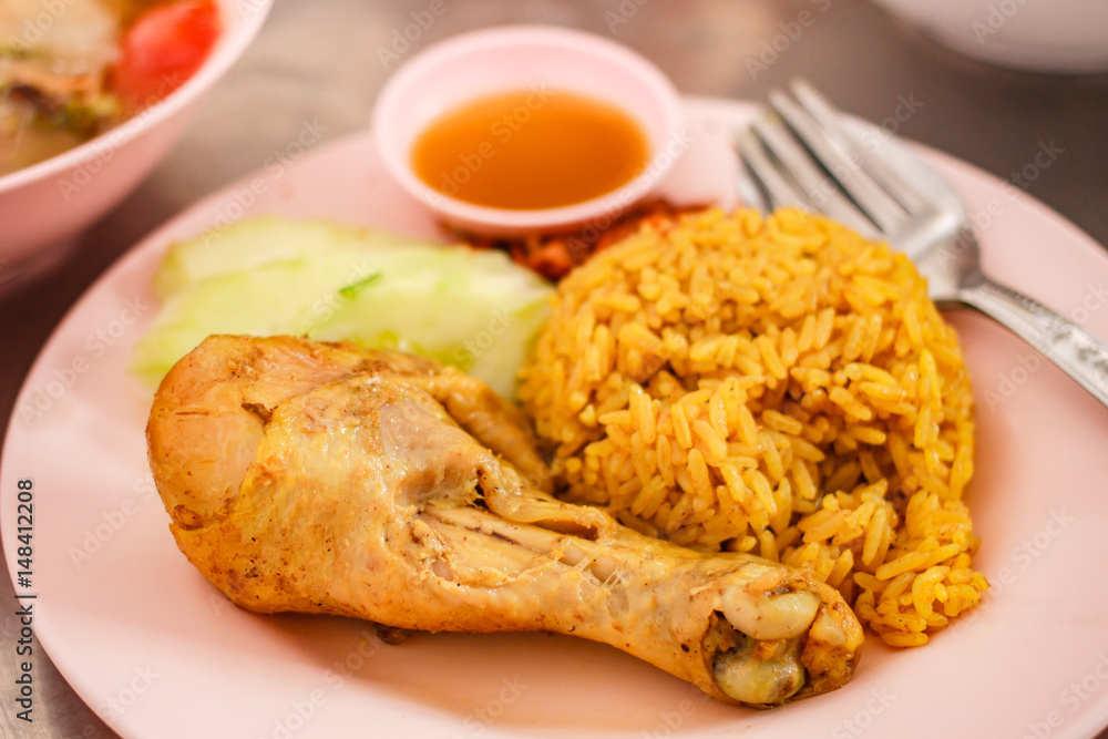 Muslim yellow jasmine rice with chicken (Khao mok kai). Muslim yellow jasmine rice with chicken (Khao mok kai).