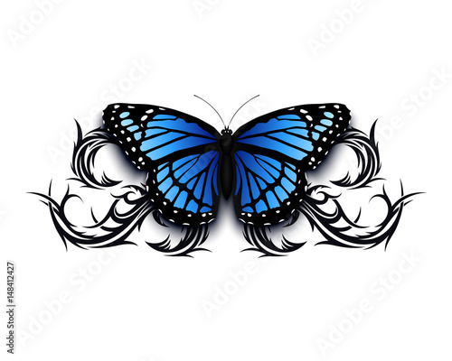 Realistic butterfly icon on top of abstract tribal.