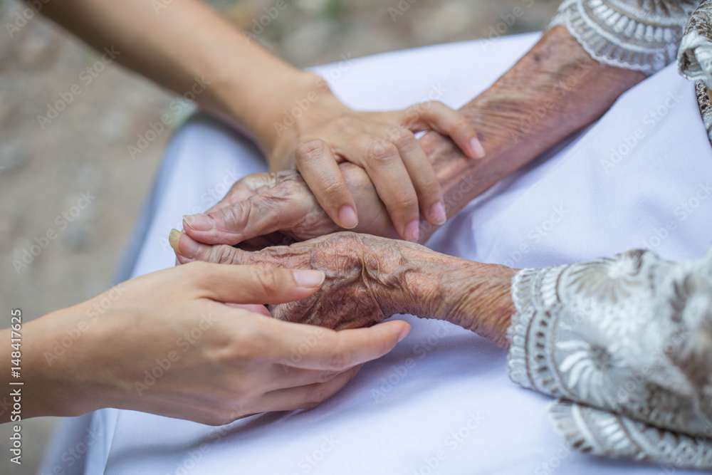 Old and young holding hands. Old and young holding hands.